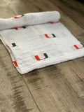 University of Miami Hurricanes Muslin Swaddle Blanket – Soft Breathable 47x47 Baby Blanket – Officially Licensed The U Newborn Gift